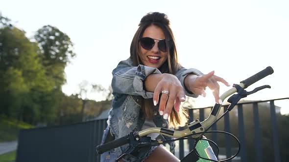 Girl in Stylish Clothing, Trendy Sunglasses with Beautiful Long Hair Dance