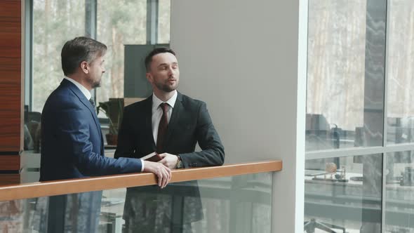 Two Lawyers Talking in Office