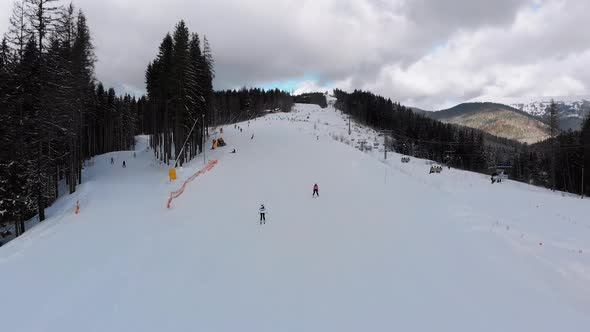 Aerial View on Ski Slopes with Skiers and Ski Lifts on Ski Resort in Winter