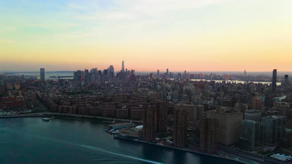 Beautiful sunset from Williamsburg Bridge to Downtown and Midtown Manhattan, aerial Panoramic shoot