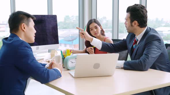 Smart Businessman and Businesswoman Talking Discussion in Group Meeting