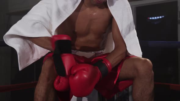 Boxer takes a break in corner of ring