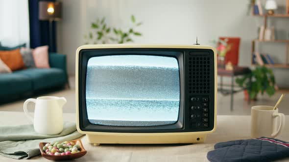 Old Television with Grey Blank Screen on Home Background Living Room