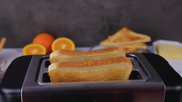 Slices of Toast Coming Out of the Toaster 