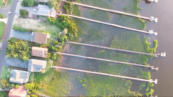 Bird's eye view of houses on the intracoastal waterway in Ocean Isle Beach NC at sunset