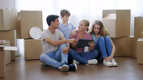 Family Watching Furniture in Digital Tablet