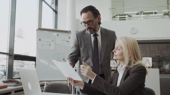 Confident Male Business Trainer Coach Ceo Leader Give Flip Chart Presentation at Office Training