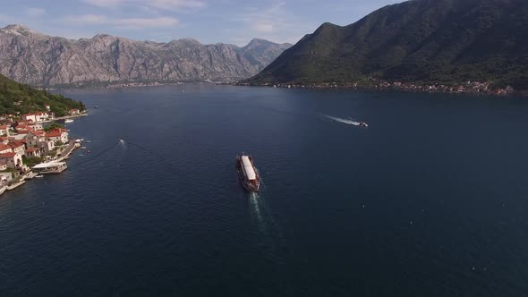 Top View of a Ship Sailing Past the City Coast