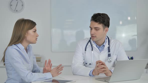 Doctor Talking with Patient, Discussing Health Treatment Plan