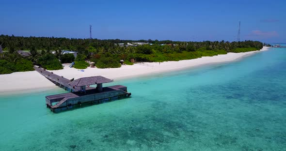 Beautiful birds eye travel shot of a sunshine white sandy paradise beach and turquoise sea backgroun