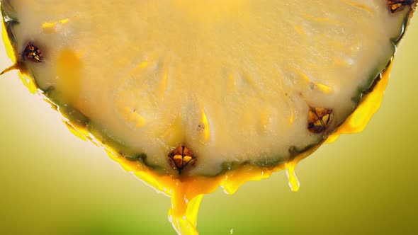 Flowing Pineapple Juice From Pineapple Slice Macro Shot in Slow Motion