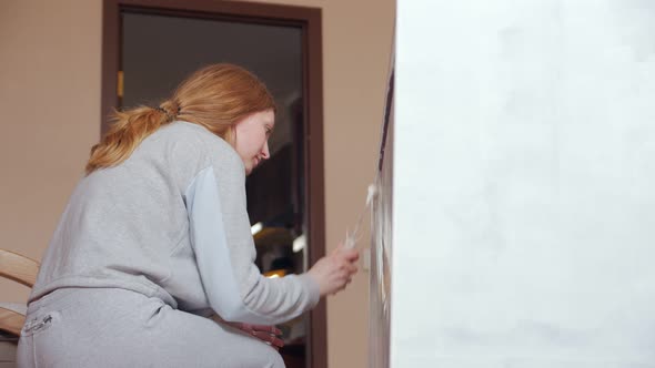 Woman Painting Furniture Cabinet