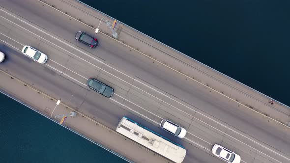 Aerial view. Two-way traffic on the bridge over the river