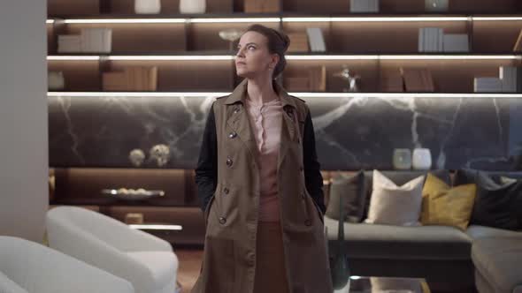 Gorgeous Elegant Woman Standing in Furniture Shop Looking Around