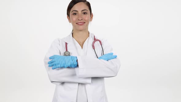 Female doctor turning and folding arms while smiling