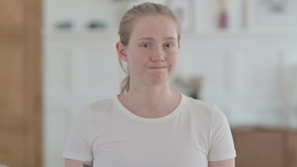 Portrait of Beautiful Young Woman Shaking Head As Yes Sign Approval