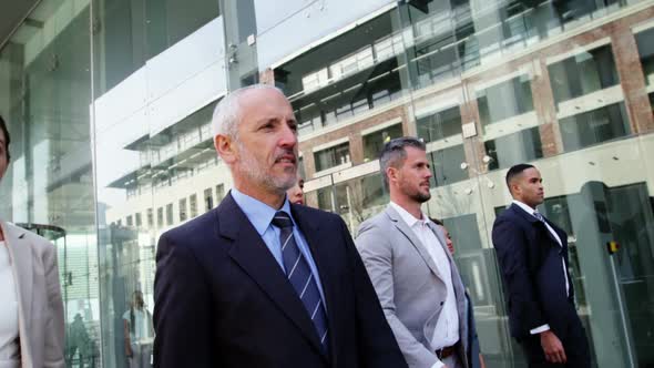 Business people walking in office building