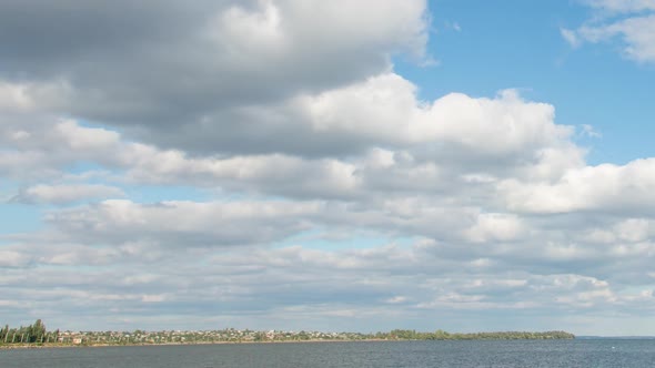 Large Clouds In The Blue Sky Near The Coast, Time Lapse