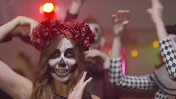 Woman in Halloween Makeup Dancing and Posing
