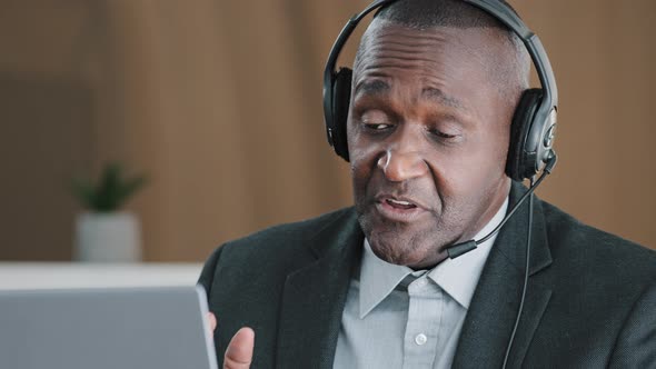 Senior Old African Businessman Senior Mature Man in Headset Agent Help Assistant Advisor Professor