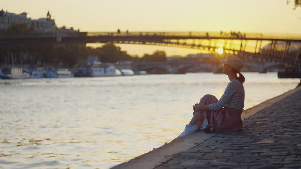 Young tourist on a picnic by the river