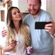 Beautiful Couple Smiling and Taking Selfies at Home - VideoHive Item for Sale