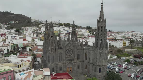 Majestic Neo Ghotic style Arucas Church against cityscape, Canary Islands, Spain