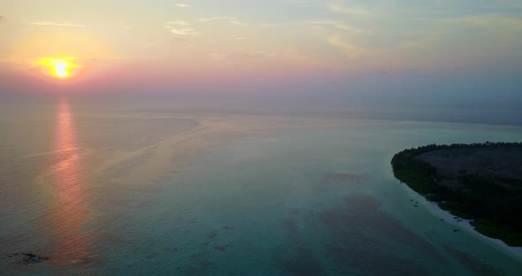 Beautiful birds eye abstract view of a paradise sunny white sand beach and blue ocean background in 