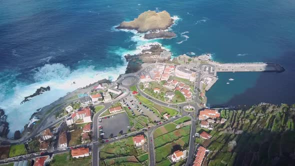 Flying over Porto Moniz town, Madeira island, Portugal famous tourist vacation destination at sunset