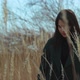 Young Brunette Walking Among the Reeds Outdoor Sunset Scene - VideoHive Item for Sale