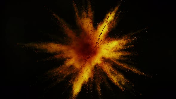 Super Slowmotion Shot of Gold Powder Explosion Isolated on Black Background