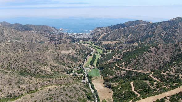 Aerial View of Santa Catalina Island Mountains and Trails with Ocean on the Background