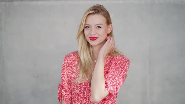 Woman in Red Dress Looking at Camera and Looking at Camera