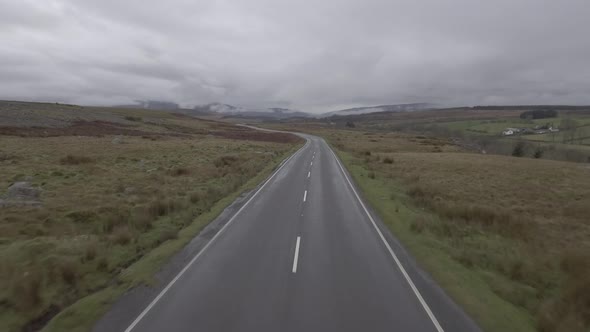 Aerial view of countryside road in Wales on a cloudy day