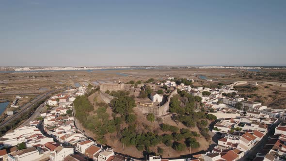 Castro Marim medieval castle. Algarve, Portugal . Small houses and salt pans. Aerial view