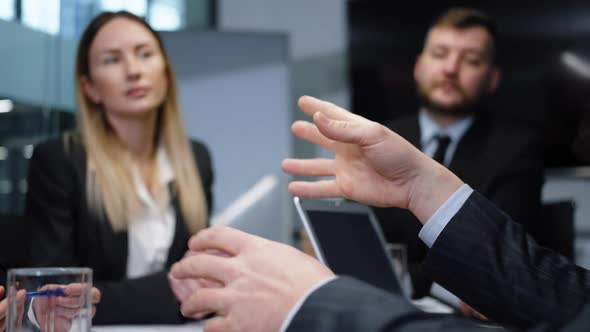 Businessman Hands During Meeting with Colleagues in Office