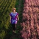 Asian Woman Walking At Green And Pink Rice Berry Field. - VideoHive Item for Sale