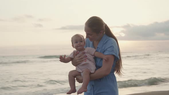 Happy Woman and Child by Sea