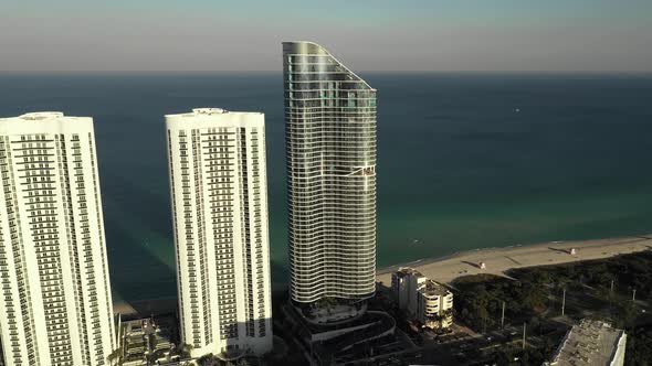 Modern highrise towers and resorts Sunny Isles Beach with view of ocean background