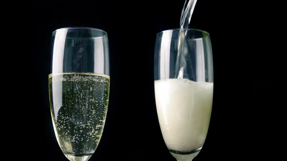 Champagne Poured Into Two Glasses