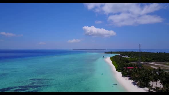 Aerial view landscape of tranquil coastline beach voyage by blue ocean with bright sand background o