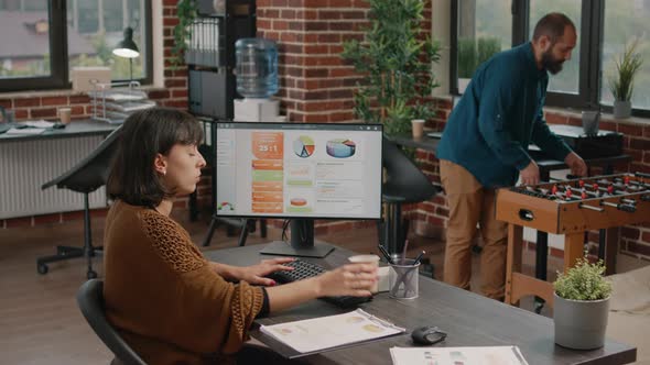 Employee Working on Computer to Plan Business Project