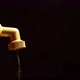Faucet is dripping and flowing slowly on a black background - VideoHive Item for Sale