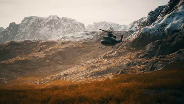 Slow Motion Vietnam War Era Helicopter in Mountains