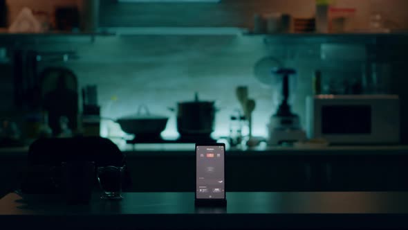Phone with Intelligent Software Placed on Table in Kitchen with Nobody in