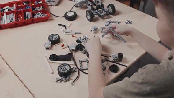 Boy Starting Building Car Model