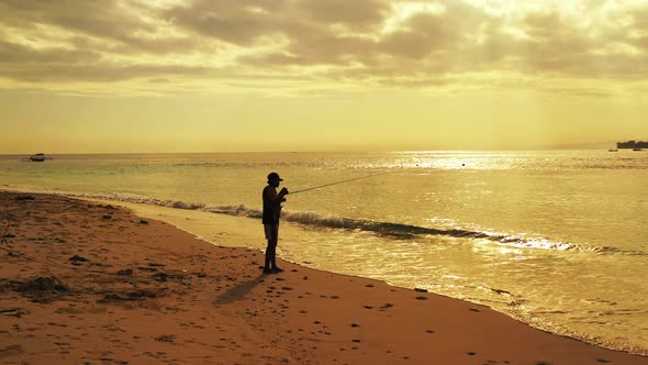 Fishing Happy guy on vacation hanging out on beach on summer white sandy and blue background 4K