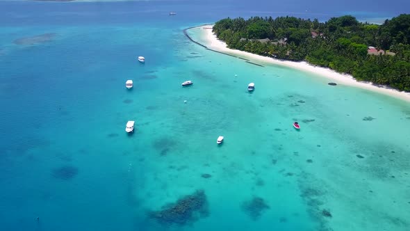 Aerial travel of resort beach trip by ocean with sand background