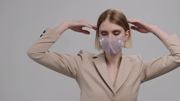 Beautiful Woman in Stylish Face Mask Dancing