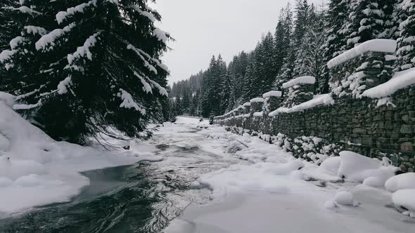 Aerial  View Drone Moving Above the Frozen River in Mountains